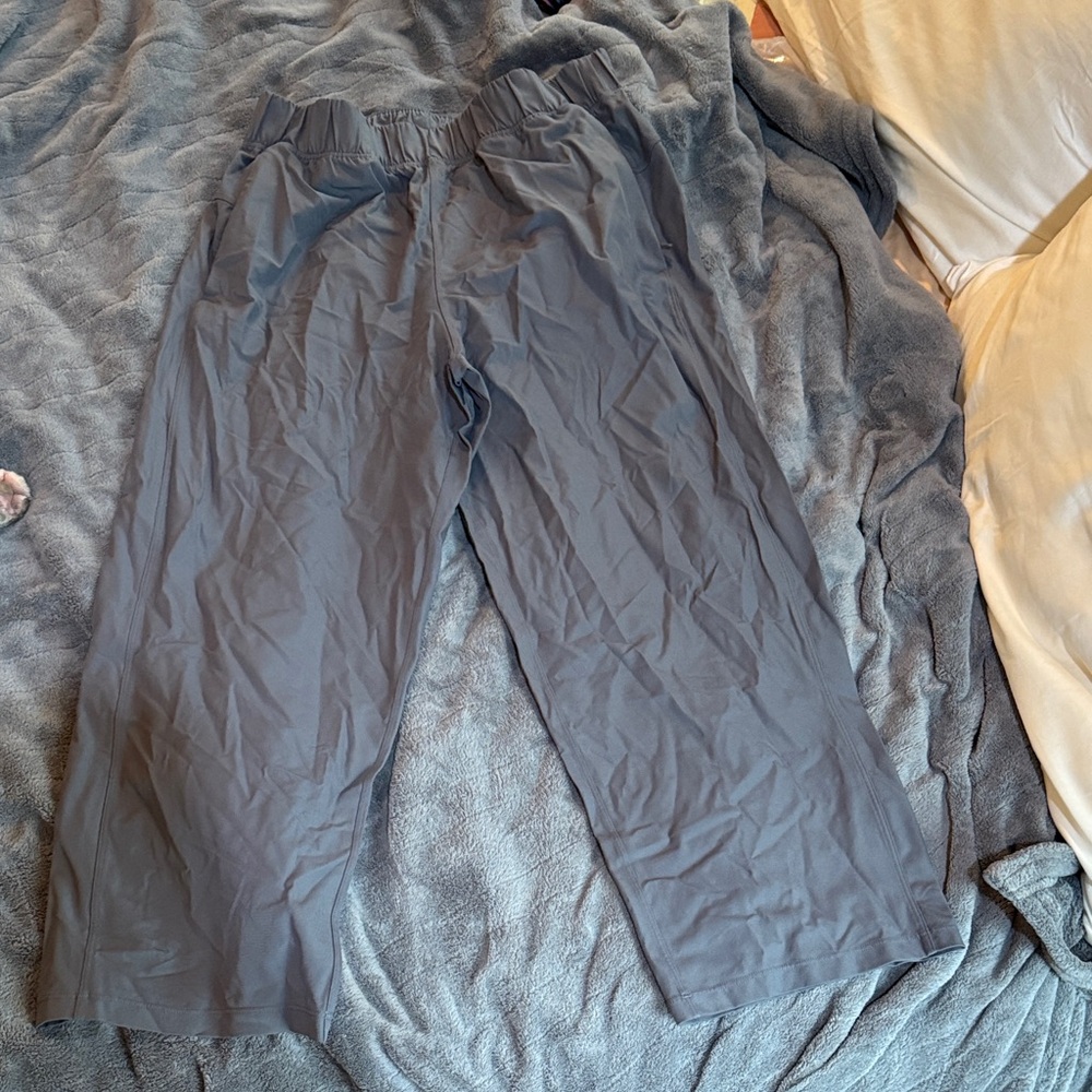 Women’s Lulu Lemon Gray Wide-Leg Pants with zippered pockets, size 6.